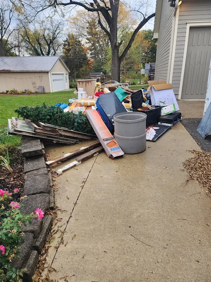 Dumpster being loaded with debris for Residential Dumpster Rental in Othello
